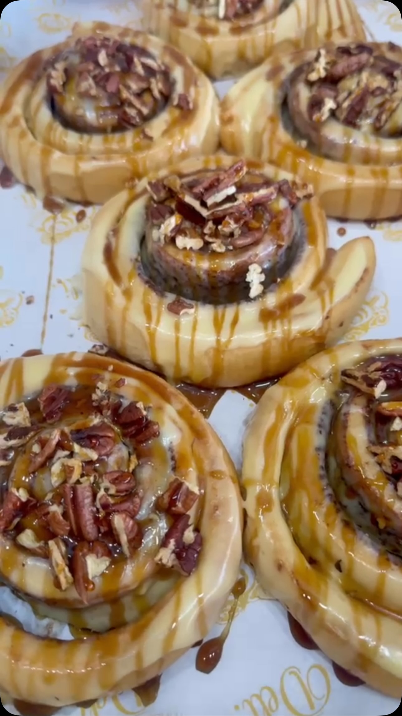Caramel pecan cinnamon rolls dripping with warm caramel