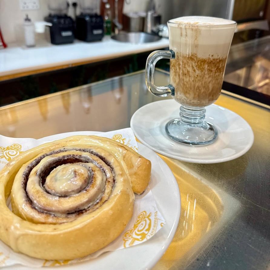 A classic cinnamon roll with a hazelnut latte