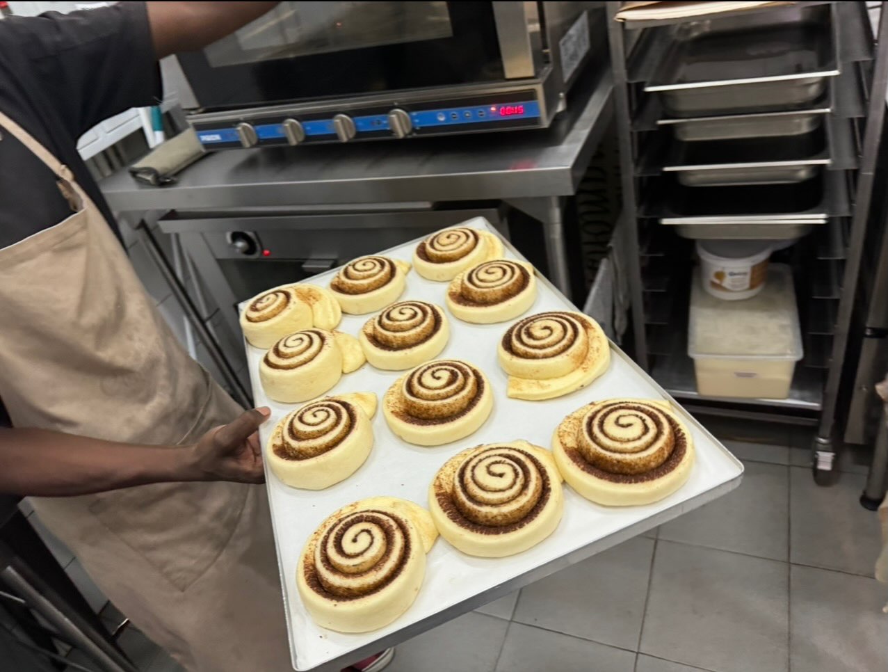 A tray of rolls going into the oven early in the morning